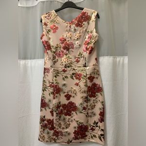 Stretchy above the knee dusty pink dress with iridescent floral pattern.